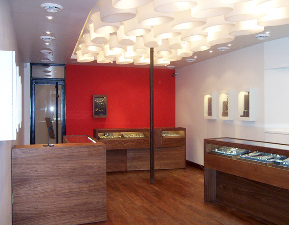 Photograph of custom jewelry display cases and inset wall displays by Townsend Design for Me&Ro Jewelry, Elizabeth St., NYC. Design: SHoP Architects