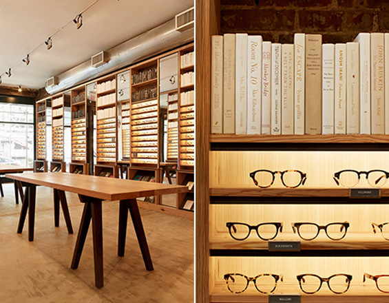 Photograph of solid antique heartpine shelving and tables, mirrors, and integrated lighting produced by Townsend Design for Warby Parker's NYC Meatpacking District retail store project.